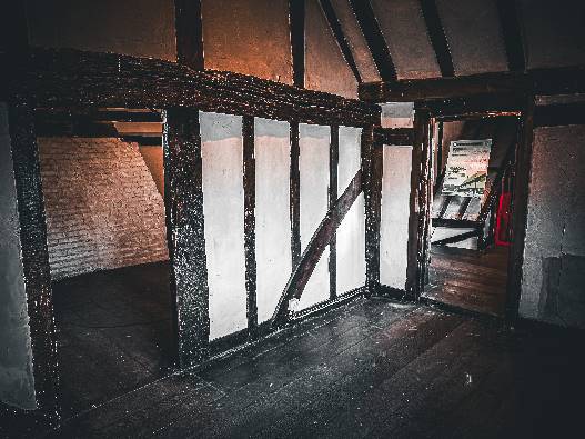 Timber-framed interior of The Mint House in Pevensey